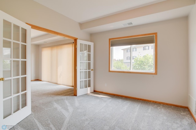 3401 28th St SW # 108, Fargo, ND 58104 - carpeted empty room with french doors and baseboards