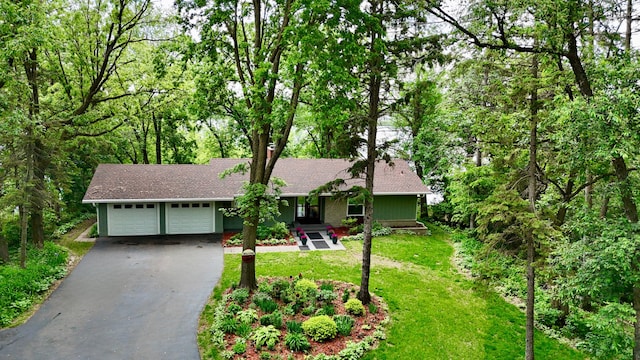 13100 Island View Dr NW, Elk River, MN 55330 - view of front of property featuring asphalt driveway, a garage, a front lawn, and roof with shingles
