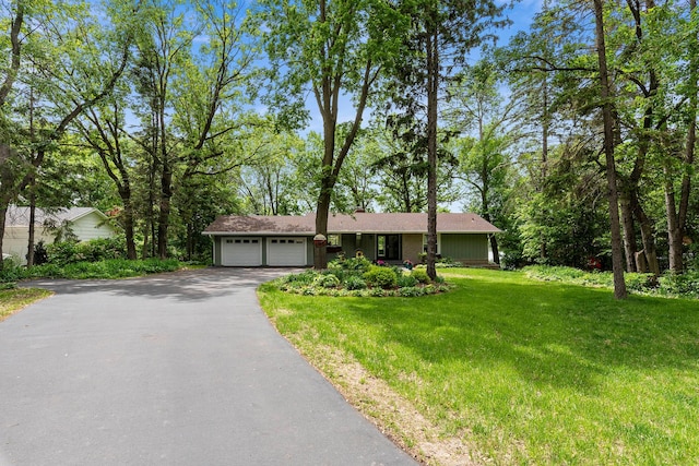 13100 Island View Dr NW, Elk River, MN 55330 - view of front of property featuring driveway, an attached garage, and a front lawn