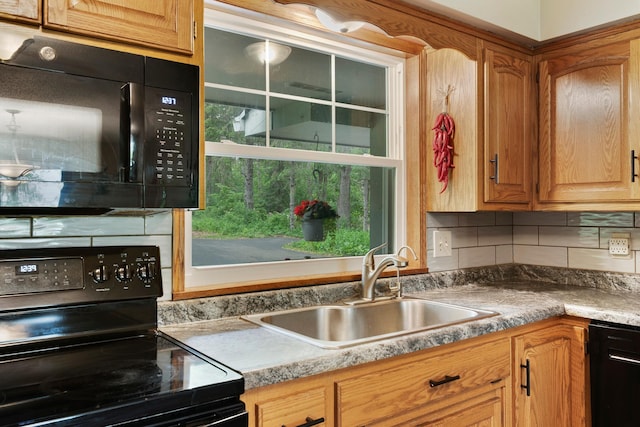 13100 Island View Dr NW, Elk River, MN 55330 - kitchen with black appliances, a sink, and backsplash