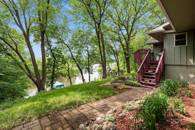 13100 Island View Dr NW, Elk River, MN 55330 - view of yard featuring stairway and a deck with water view