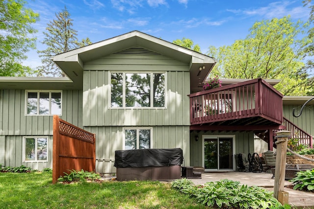 13100 Island View Dr NW, Elk River, MN 55330 - rear view of property with a patio, board and batten siding, and a deck