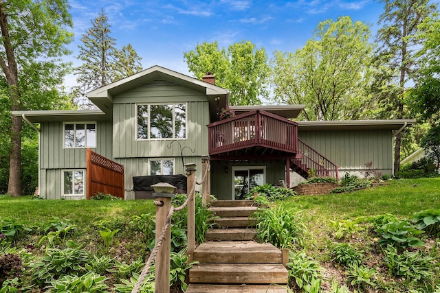 13100 Island View Dr NW, Elk River, MN 55330 - view of front of property featuring stairway, a deck, and a chimney