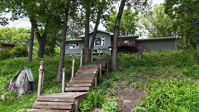 13100 Island View Dr NW, Elk River, MN 55330 - rear view of house with stairway and a wooden deck