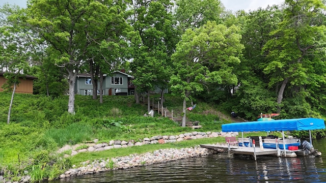 13100 Island View Dr NW, Elk River, MN 55330 - dock featuring a water view and boat lift