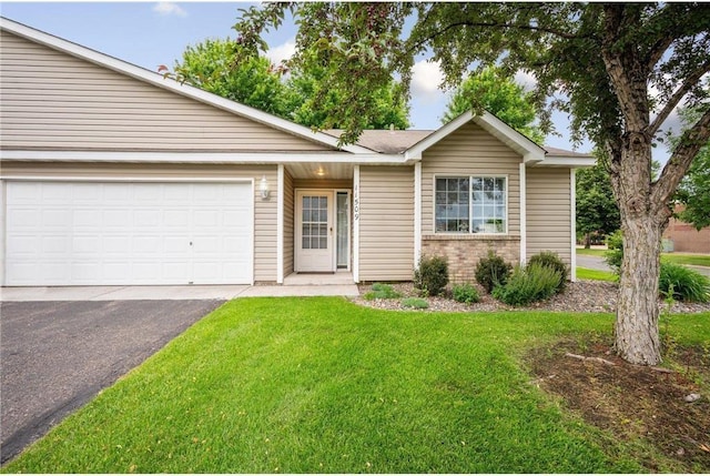 11509 Quay St, Coon Rapids, MN 55433 - ranch-style home with asphalt driveway, a front lawn, brick siding, and an attached garage