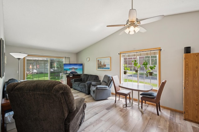 11509 Quay St, Coon Rapids, MN 55433 - living area featuring light wood finished floors, healthy amount of natural light, lofted ceiling, and ceiling fan