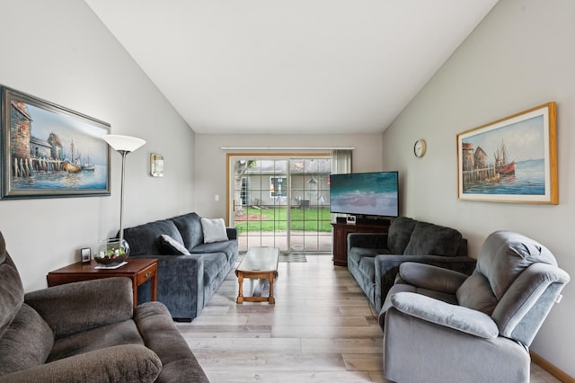 11509 Quay St, Coon Rapids, MN 55433 - living area with vaulted ceiling and light wood-type flooring