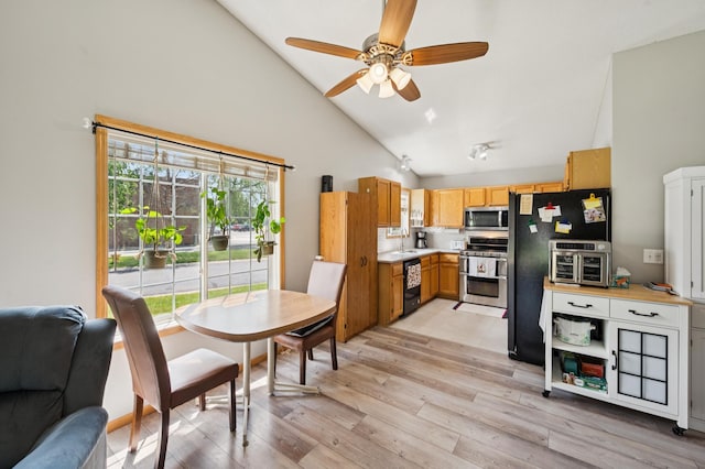 11509 Quay St, Coon Rapids, MN 55433 - kitchen featuring appliances with stainless steel finishes, high vaulted ceiling, a ceiling fan, light wood-type flooring, and light countertops