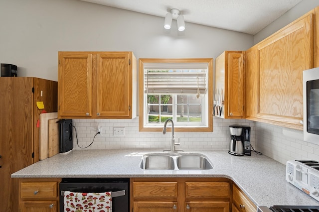 11509 Quay St, Coon Rapids, MN 55433 - kitchen with dishwashing machine, a sink, tasteful backsplash, and lofted ceiling