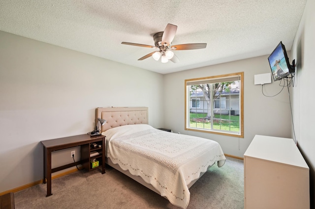11509 Quay St, Coon Rapids, MN 55433 - bedroom with light carpet, baseboards, a ceiling fan, and a textured ceiling
