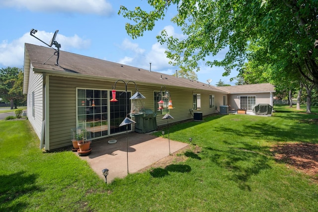 11509 Quay St, Coon Rapids, MN 55433 - rear view of house with a patio area, central air condition unit, and a lawn