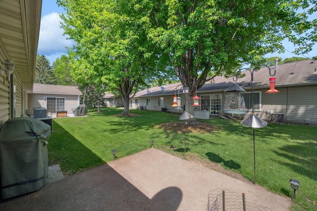 11509 Quay St, Coon Rapids, MN 55433 - view of green lawn with a patio area