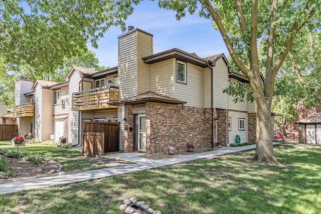 320 Ford Rd Unit 3, Saint Louis Park, MN 55426 - view of front of home with a balcony, a chimney, and brick siding