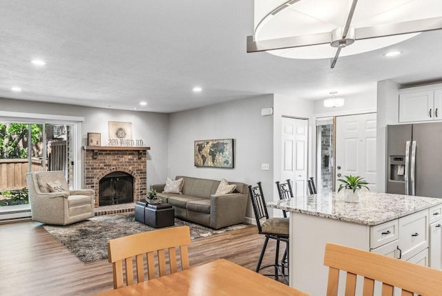 320 Ford Rd Unit 3, Saint Louis Park, MN 55426 - living area featuring wood finished floors, recessed lighting, a fireplace, and ceiling fan