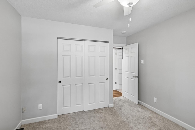 320 Ford Rd Unit 3, Saint Louis Park, MN 55426 - unfurnished bedroom featuring carpet, a closet, a textured ceiling, and ceiling fan
