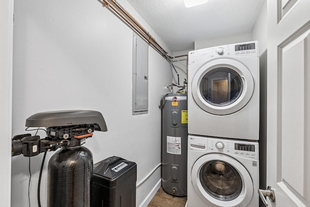 320 Ford Rd Unit 3, Saint Louis Park, MN 55426 - laundry room featuring estacked washer and dryer, electric water heater, wood finished floors, electric panel, and a textured ceiling