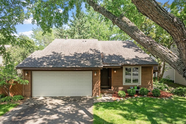 5554 Knoll Dr, Shoreview, MN 55126 - view of front of property featuring roof with shingles, driveway, a garage, and a front yard