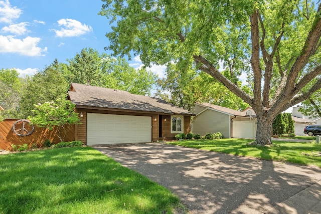 5554 Knoll Dr, Shoreview, MN 55126 - view of front of property featuring an attached garage, a front lawn, and driveway