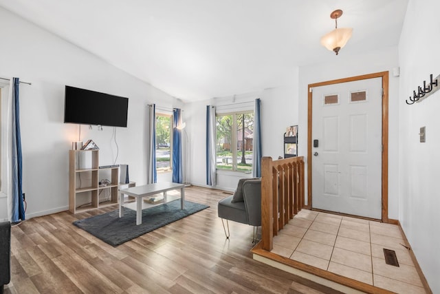 5554 Knoll Dr, Shoreview, MN 55126 - entrance foyer with wood finished floors, lofted ceiling, and baseboards