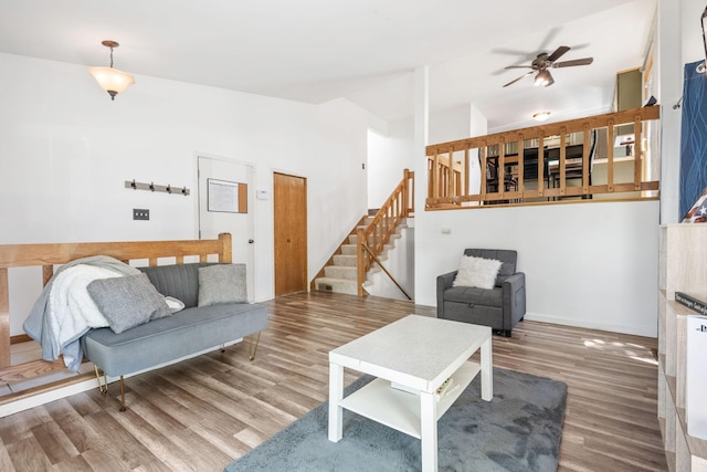 5554 Knoll Dr, Shoreview, MN 55126 - living room with ceiling fan, wood finished floors, stairs, and lofted ceiling