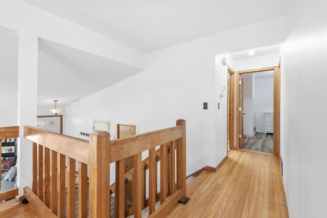 5554 Knoll Dr, Shoreview, MN 55126 - hall with an upstairs landing, light wood-style flooring, and baseboards