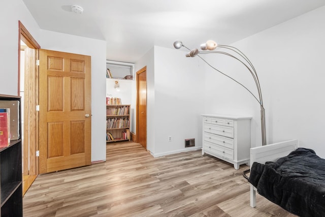 5554 Knoll Dr, Shoreview, MN 55126 - bedroom featuring wood finished floors and baseboards