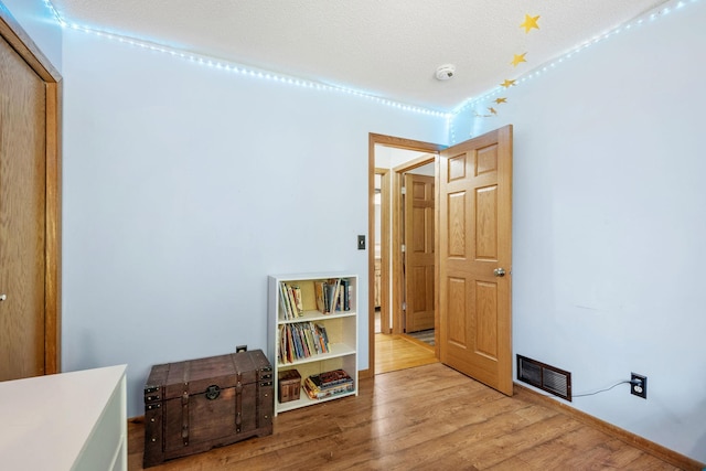 5554 Knoll Dr, Shoreview, MN 55126 - bedroom featuring wood finished floors and baseboards