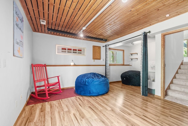 5554 Knoll Dr, Shoreview, MN 55126 - unfurnished room with wood finished floors, healthy amount of natural light, baseboards, stairway, and wooden ceiling