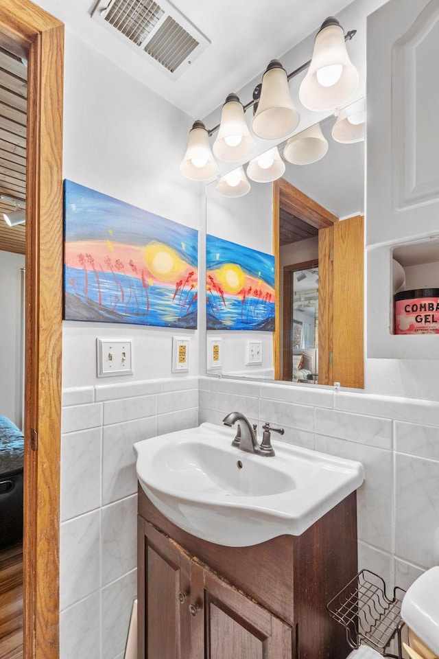 5554 Knoll Dr, Shoreview, MN 55126 - half bathroom with tile walls and vanity