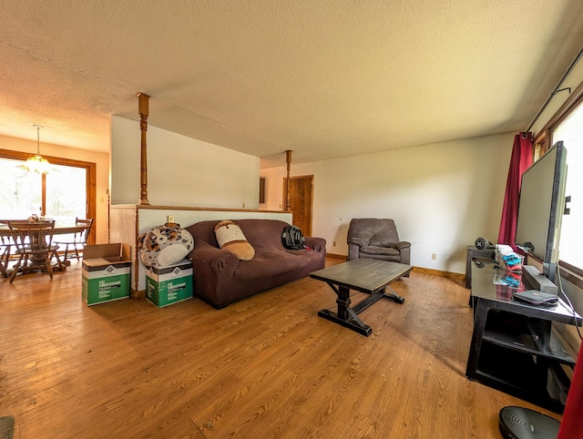 1422 6th St SE, Wadena, MN 56482 - living area featuring wood finished floors and a textured ceiling