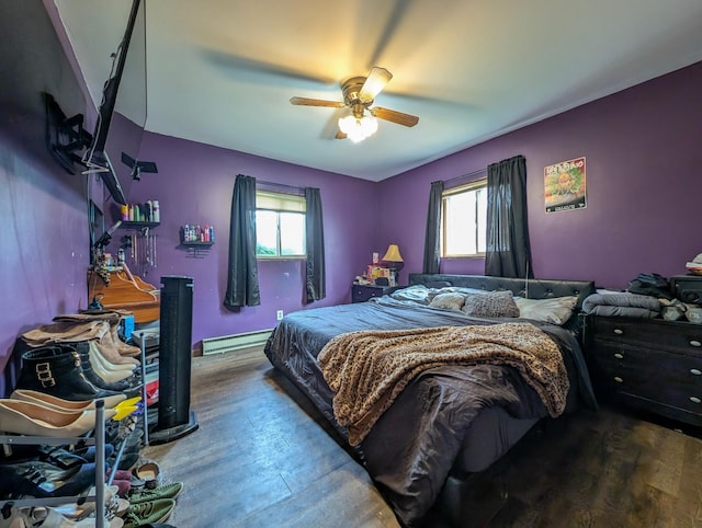 1422 6th St SE, Wadena, MN 56482 - bedroom with a baseboard radiator, wood finished floors, and a ceiling fan