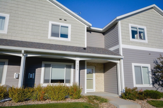 5656 Harvest Moon Blvd NW, Rochester, MN 55901 - view of side of home with roof with shingles and brick siding