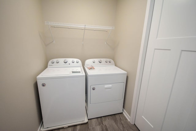 5656 Harvest Moon Blvd NW, Rochester, MN 55901 - laundry area featuring washer and dryer, dark wood-type flooring, and baseboards