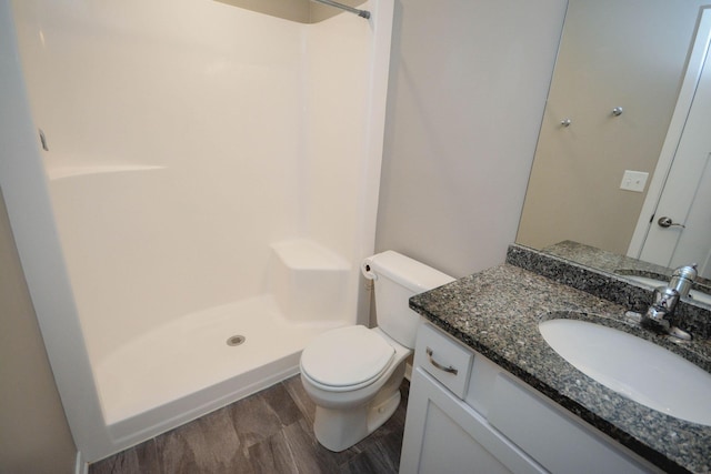 5656 Harvest Moon Blvd NW, Rochester, MN 55901 - full bath featuring a stall shower, toilet, wood finished floors, and vanity