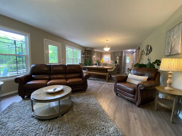 3771 County Line Rd, Moose Lake Twp, MN 55783 - living area with wood finished floors and healthy amount of natural light
