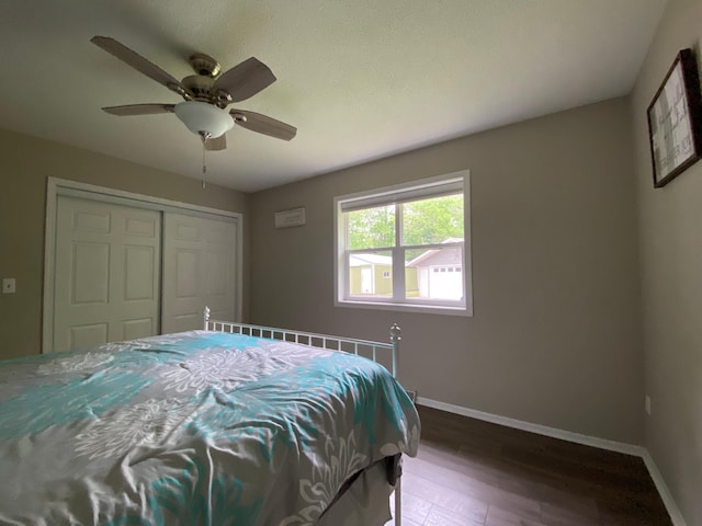 3771 County Line Rd, Moose Lake Twp, MN 55783 - bedroom with wood finished floors, baseboards, a closet, and ceiling fan