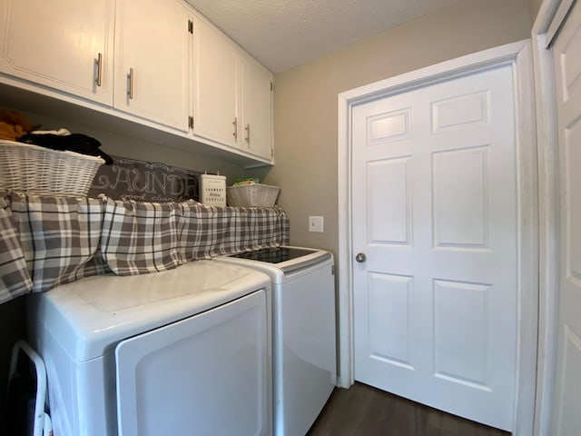 3771 County Line Rd, Moose Lake Twp, MN 55783 - laundry room with cabinet space, washer and dryer, dark wood-type flooring, and a textured ceiling
