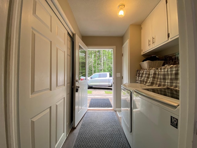 3771 County Line Rd, Moose Lake Twp, MN 55783 - laundry room featuring cabinet space, washing machine and clothes dryer, a textured ceiling, and baseboards