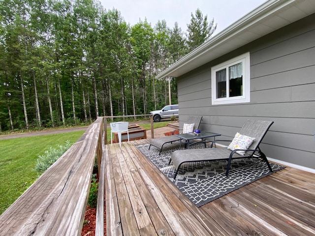 3771 County Line Rd, Moose Lake Twp, MN 55783 - wooden terrace with a lawn and outdoor dining space