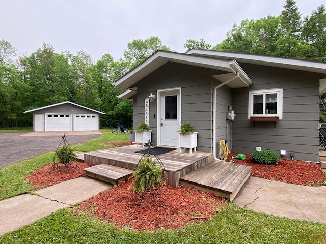 3771 County Line Rd, Moose Lake Twp, MN 55783 - view of front of house with a detached garage and an outbuilding