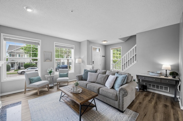 2099 Clover Ridge Dr, Chaska, MN 55318 - living area featuring a textured ceiling, plenty of natural light, wood finished floors, and baseboards