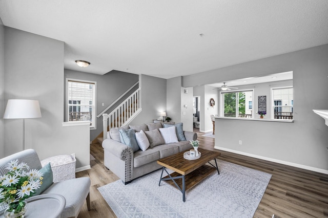 2099 Clover Ridge Dr, Chaska, MN 55318 - living room featuring stairway, wood finished floors, ceiling fan, and baseboards