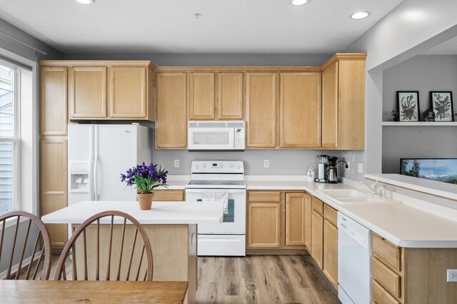 2099 Clover Ridge Dr, Chaska, MN 55318 - kitchen with white appliances, light brown cabinets, a sink, light wood-type flooring, and recessed lighting