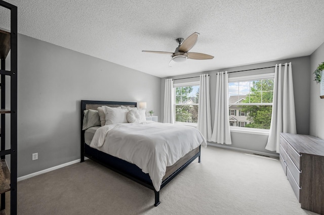 2099 Clover Ridge Dr, Chaska, MN 55318 - bedroom featuring light carpet, a textured ceiling, ceiling fan, and baseboards