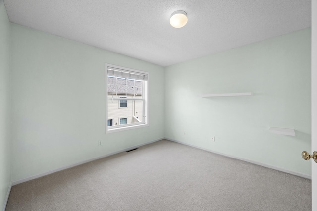 2099 Clover Ridge Dr, Chaska, MN 55318 - carpeted spare room featuring baseboards and a textured ceiling