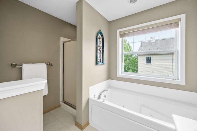 2099 Clover Ridge Dr, Chaska, MN 55318 - bathroom featuring a tub with jets, a stall shower, baseboards, and tile patterned flooring