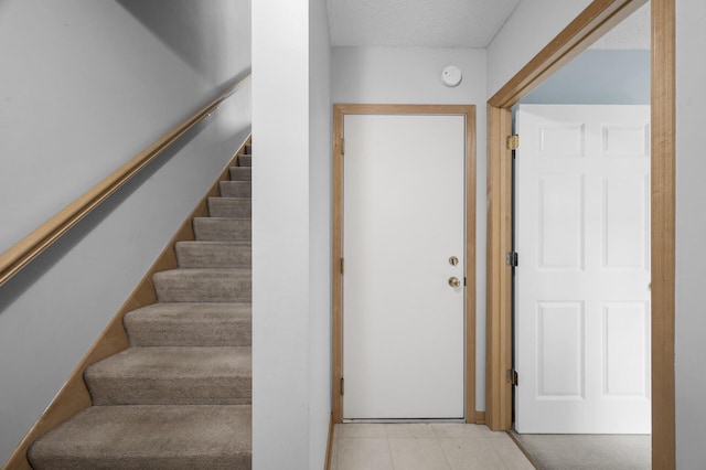 2099 Clover Ridge Dr, Chaska, MN 55318 - stairs featuring a textured ceiling