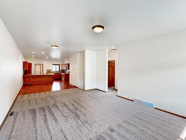 816 3rd St N Unit 816, Fargo, ND 58102 - unfurnished living room with carpet flooring and baseboards