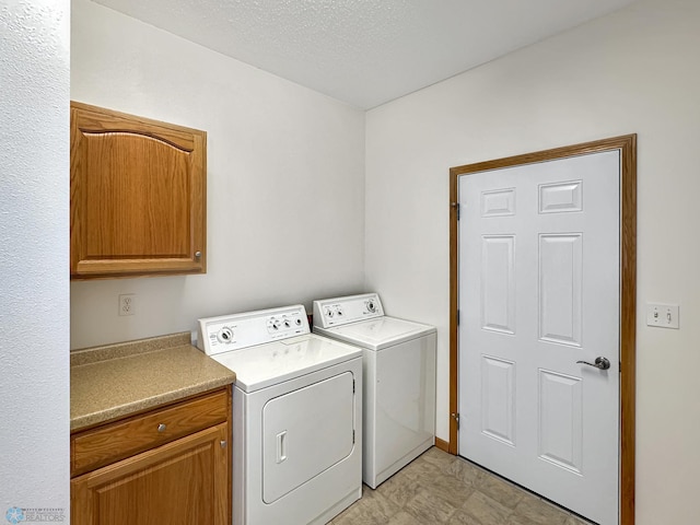 816 3rd St N Unit 816, Fargo, ND 58102 - washroom with independent washer and dryer, cabinet space, and a textured ceiling